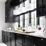 black kitchen cabinets natural light as balancing feature. GYBLWIK