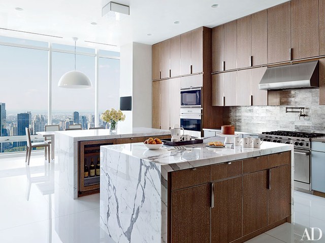 contemporary kitchens cerused-oak cabinetry lines a rockwell group-designed manhattan penthouseu0027s  kitchen. the wall PXLLNHT