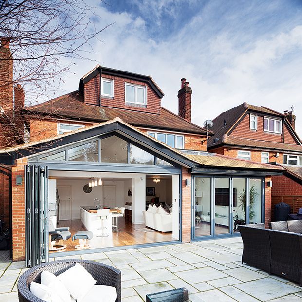 kitchen extensions powder coated aluminium bi-fold doors on a glazed kitchen extension YBSWFZV