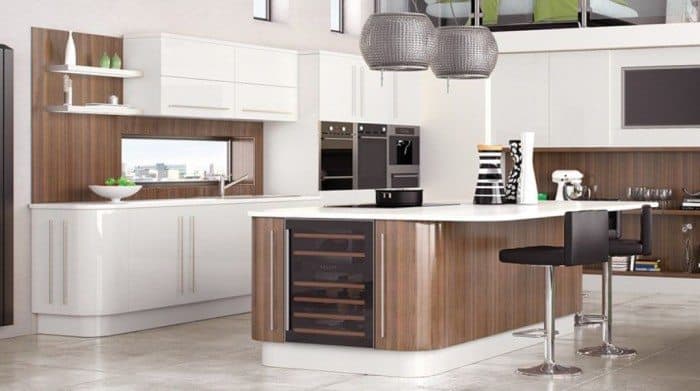 modern fitted kitchen with white cabinets and an island with wine storage CPJJHUW