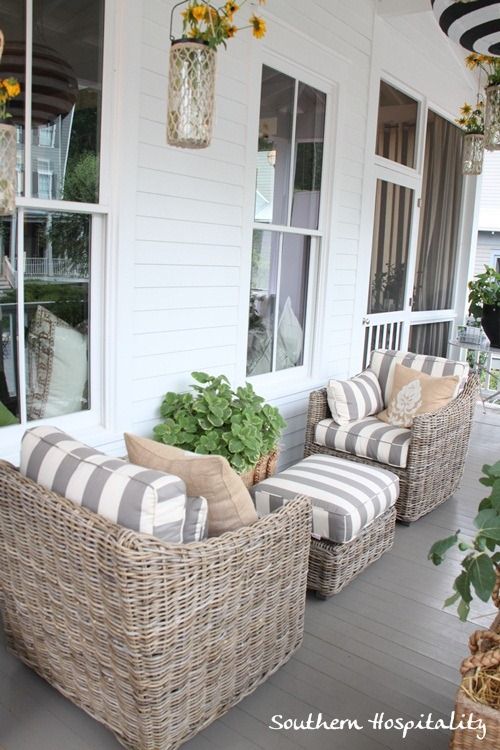 porch furniture love this combo of weathered wicker and grey/white stripes. ballard house  front EICRESI