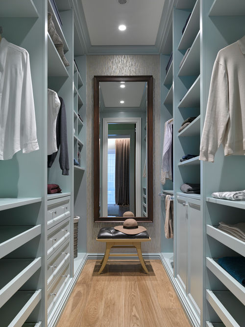 walkin closet small transitional gender-neutral medium tone wood floor and brown floor  walk-in closet KNJBEHK