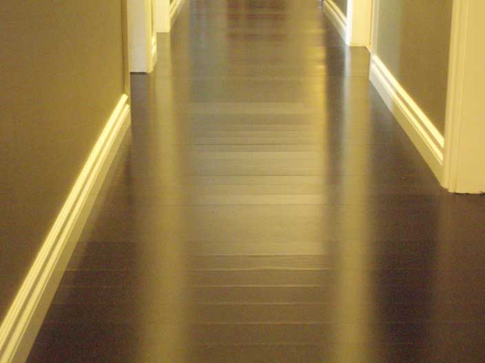 best flooring options hallway with engineered hardwood flooring in black LUXRHQF