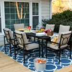 outdoor rug under patio table these very practical small patio decorating ideas are by kelly of view CIIGBFJ
