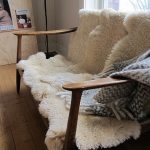 sheepskin rug ideas awesome couch idea. entertaining only-- doesnu0027t look very comfy. sheepskin  rugwooden ... ROHQUUP
