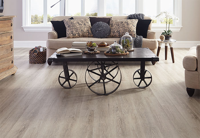 vinyl wood flooring light planks of wood-look vinyl flooring in a living room. MEKTETK