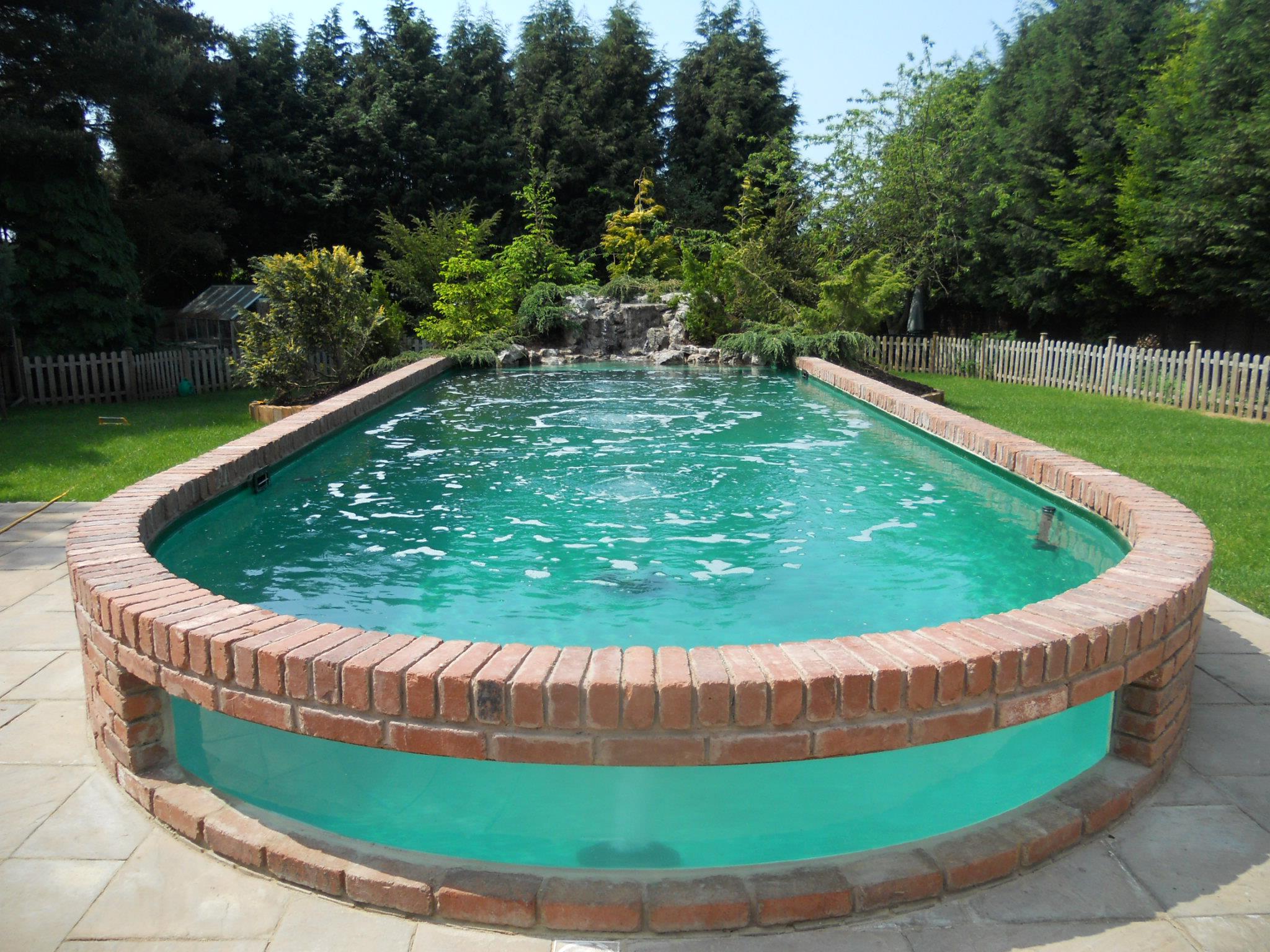 above ground pools that look like in ground above ground pools can come with waterfall features. image source ... RESQXWH