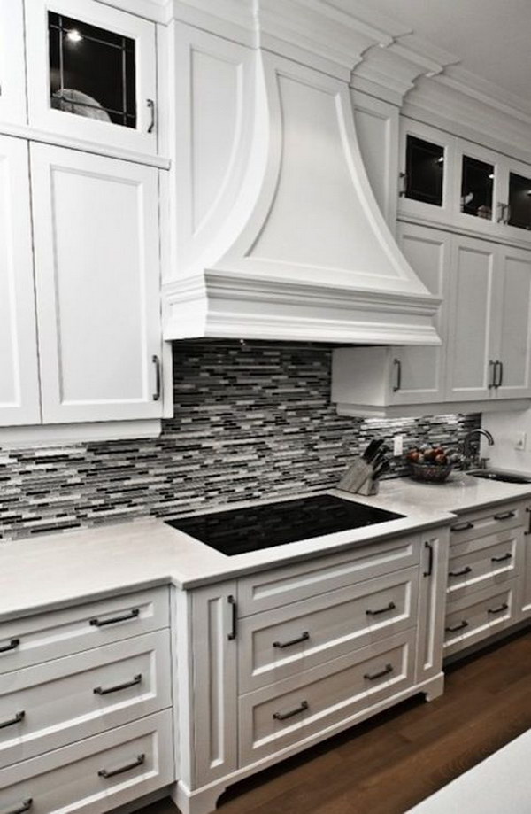 black and white kitchen backsplash ideas black or grey linear glass tile backsplash with crisp white cabinetry DTMGXTY