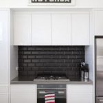 black and white kitchens with a splash of colour #kitchengoals black and white. black subway tile backsplash with black JHBKXRV