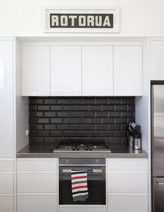 black and white kitchens with a splash of colour #kitchengoals black and white. black subway tile backsplash with black JHBKXRV