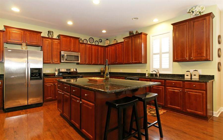 cherry kitchen cabinets with granite countertops of LVQUVWL