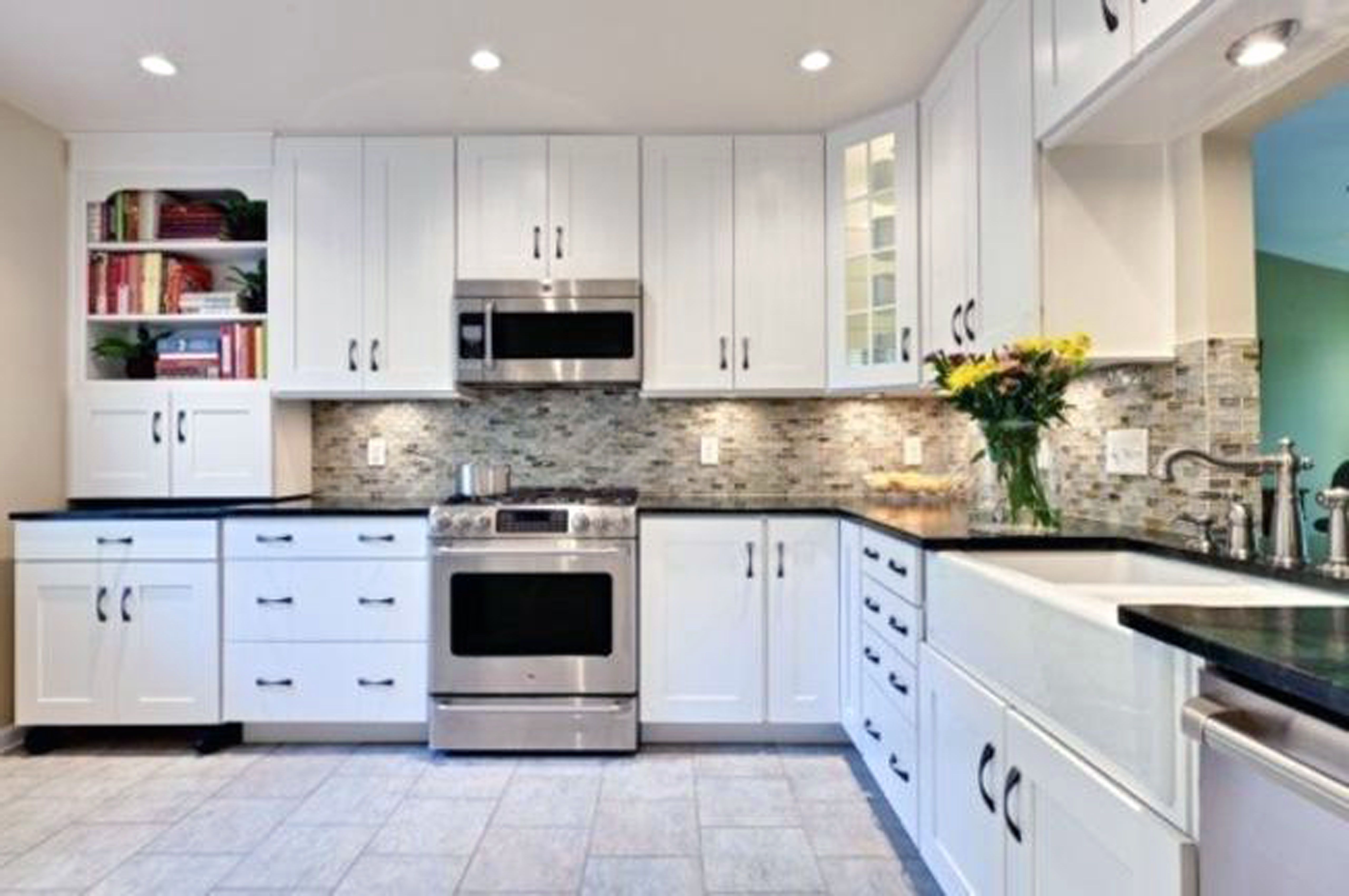 kitchen with white cabinets and black countertops ... bookcase a perfect backsplash ideas for white cabinets and XRGCIUU