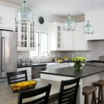 kitchen with white cabinets and black countertops traditional kitchen by winn design+build VSHLLYZ