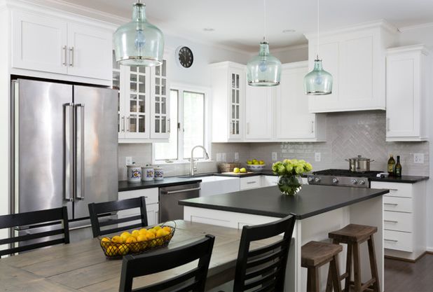 kitchen with white cabinets and black countertops traditional kitchen by winn design+build VSHLLYZ