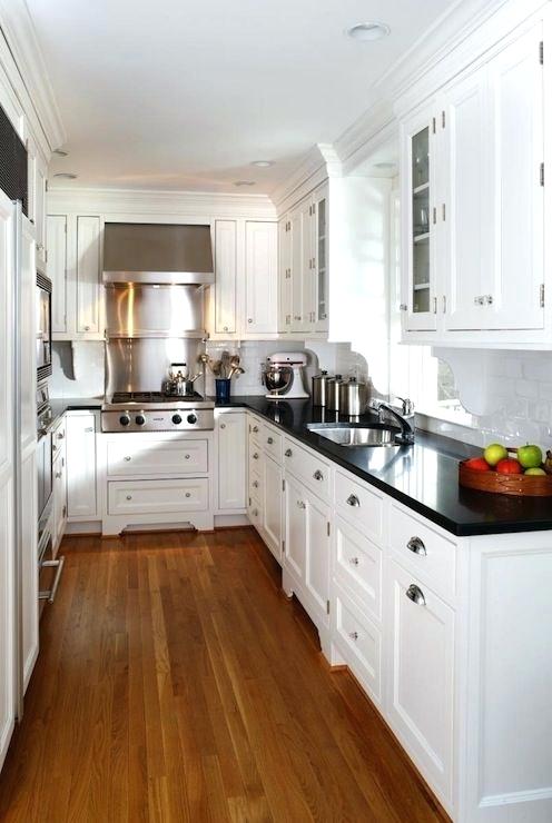 kitchen with white cabinets and black countertops white kitchen cabinets with black countertops white cabinets white XBSXIQF