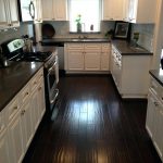 kitchens with white cabinets and dark floors white kitchen cabinets with dark floors kitchen dark counters dark UHFOZMA