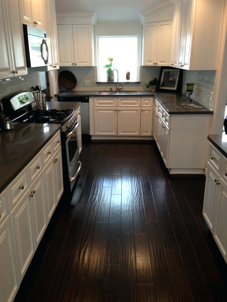 kitchens with white cabinets and dark floors white kitchen cabinets with dark floors kitchen dark counters dark UHFOZMA