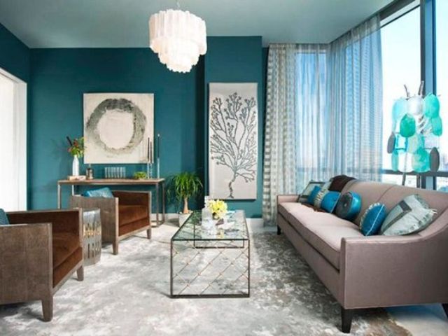 living room accent wall with brown furniture a teal accent wall, aqua blue accessories and brown upholstered BMNYUOV