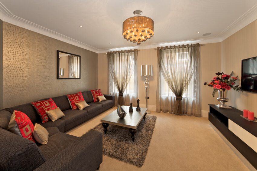 living room accent wall with brown furniture two layers of sheer curtains provide privacy, but still let YQPBVPV