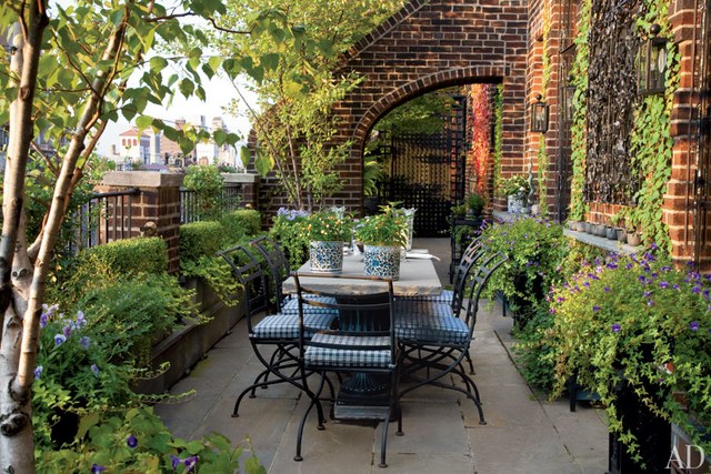 outdoor design ideas for small outdoor space birch trees provide shade for the outdoor dining area of JZOEIRA