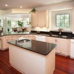 white kitchen cabinets with black countertops this lovely kitchen continues the bright, open feel apparent in VKXVMHS