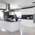 white kitchen cabinets with black countertops this striking, contemporary kitchen utilizes black counters and bold accent JIKZVID