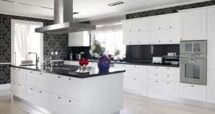 white kitchen cabinets with black countertops this striking, contemporary kitchen utilizes black counters and bold accent JIKZVID