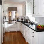 white kitchen cabinets with black countertops YRSPRRR