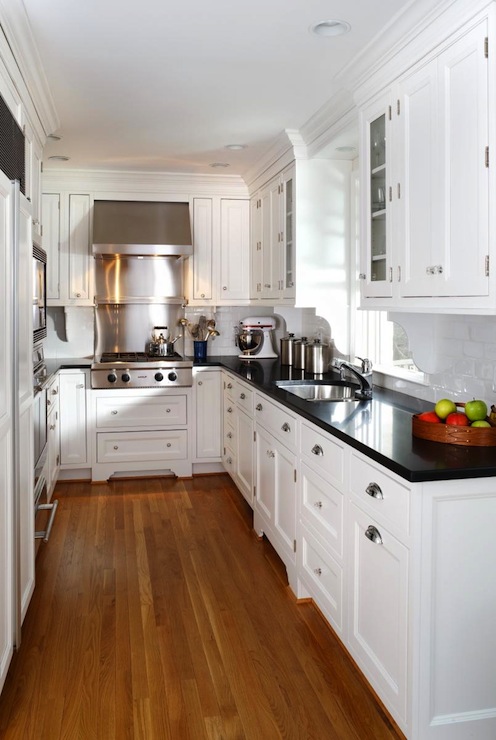 white kitchen cabinets with black countertops YRSPRRR