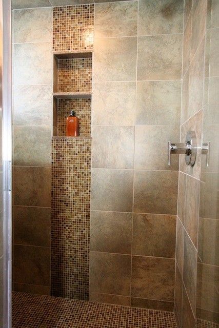 I like when they use accent tile in the vertical. shower ideas