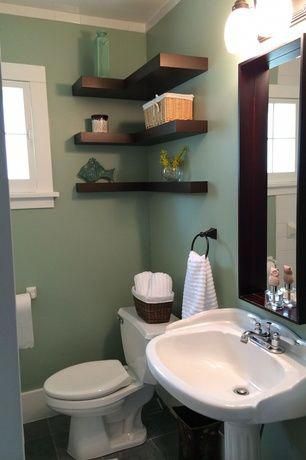 Traditional Powder Room with Wicker baskets, stone tile floors .