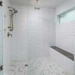 Beautiful shower with hexagonal tile, white 4 x 16 white subway .