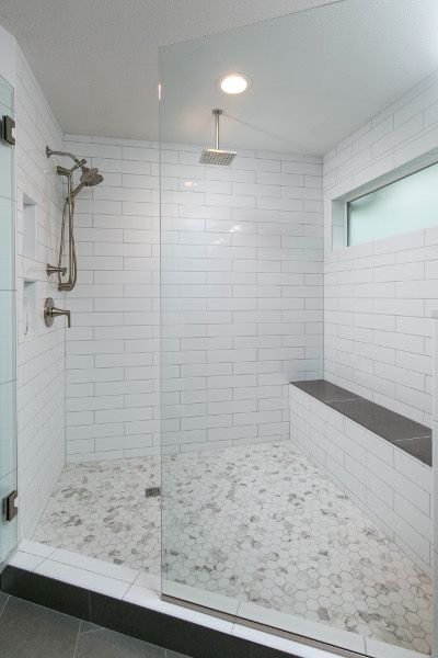 Beautiful shower with hexagonal tile, white 4 x 16 white subway .