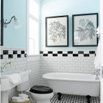 Vintage style bathroom with black & white tile, claw foot tub .