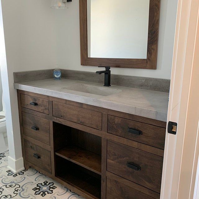 Concrete bathroom vanity top with integral sink and backsplash .