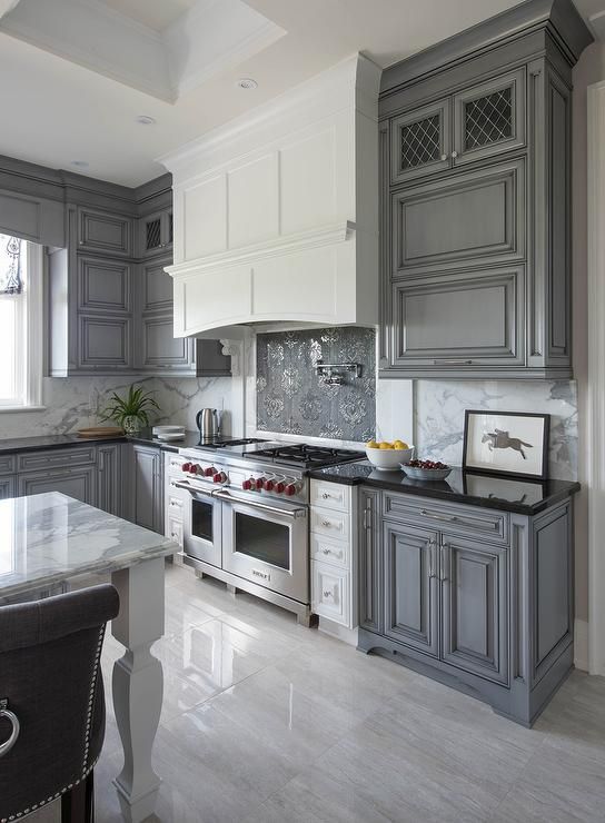 Pair gray cabinets with warm colors and materials. Gray can appear .