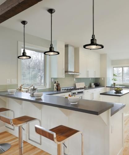 Industrial pendant lights accent a transitional kitchen picture .