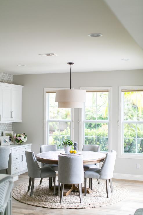 Light Gray Linen Dining Chairs on Round Jute Rug - Transitional .