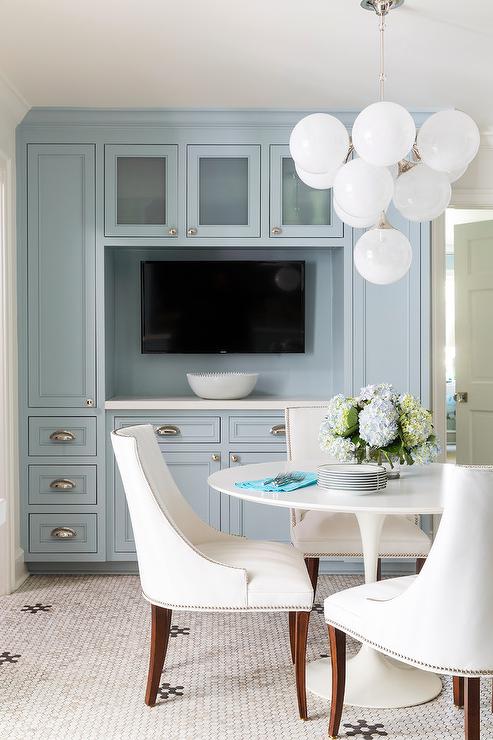 White Fabric Nailhead Dining Chairs at Saarinen Table .