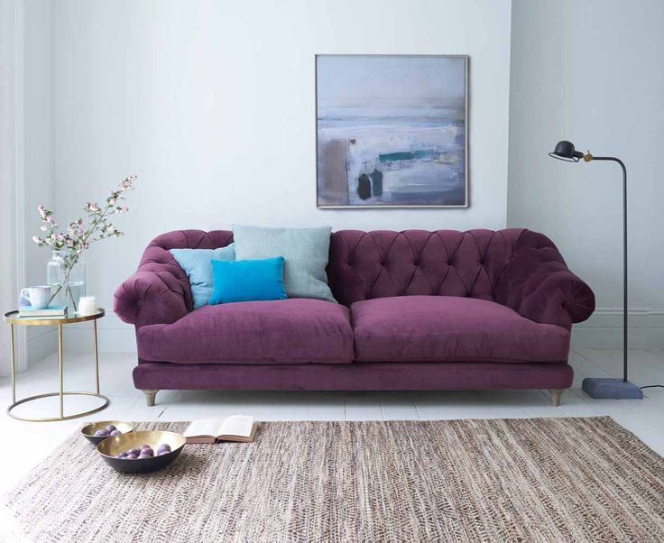 living room with purple sofa
