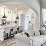 white living room neutral farmhouse kitchen with dark hardwood floors. farmhouse kitchen with  open layout. WJLGXUA