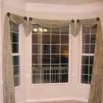 window scarves home design and decor , pretty window scarf ideas : bay window asymmetrical RWUUXYE
