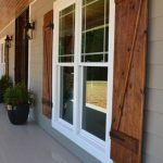 wood shutters front porch with custom ceiling, cedar posts, stone columns and wood  shutters. RNKIQNZ