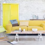 yellow sofa white washed bricks wall and yellow pale sofa SAFFYTU