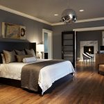 hardwood floors in bedroom home decorating example of a trendy master bedroom design in seattle with gray walls dark FGWXHBW
