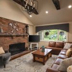 family room design ideas with fireplace inspiration for a mid-sized timeless enclosed medium tone wood floor YNXFLGE