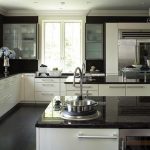 kitchen with white cabinets and black countertops dark granite countertops VOWQRIC