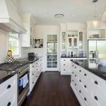 kitchens with white cabinets and dark floors this gorgeous contemporary kitchen utilizes dark granite counter tops and NFVXJNT