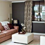 living room accent wall with brown furniture brown walls living room decor FLCXCPV