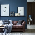 living room accent wall with brown furniture chic seating area with a brown sofa and a navy AAWFMLQ